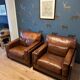 Ensemble de deux fauteuils en cuir de buffle.