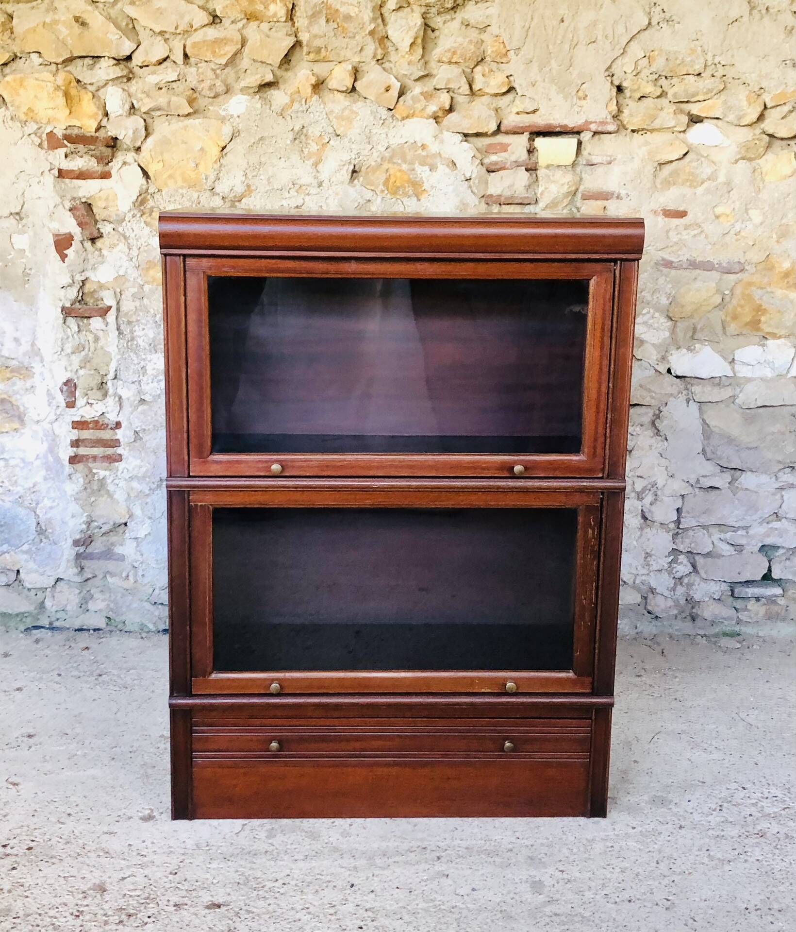 Vintage mahogany avocado bookcase with overhead glass doors circa 40's/50's