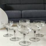 Set of 6 Baccarat-style champagne glasses. Stylized grape cluster decoration.