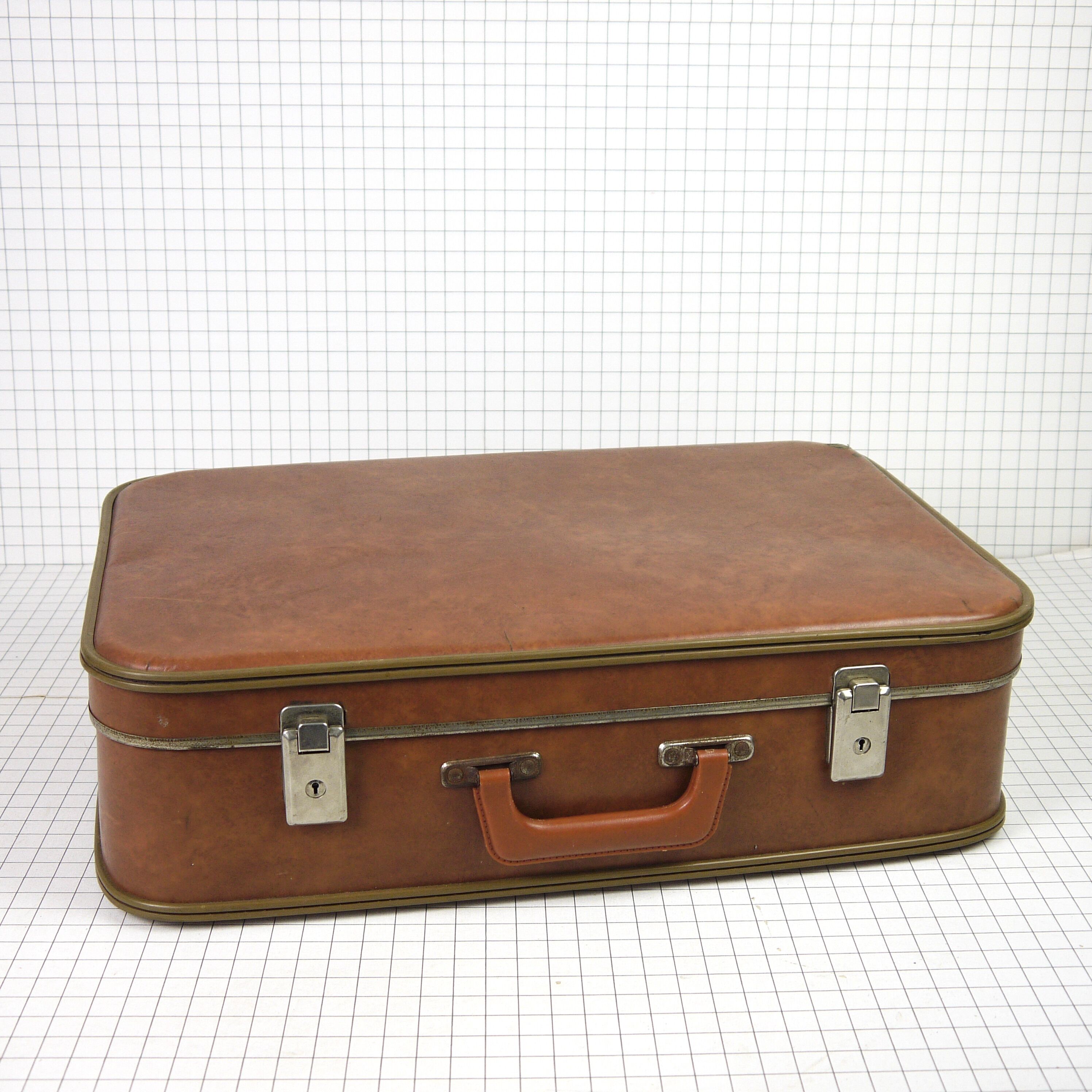 Cardboard and brown leather case