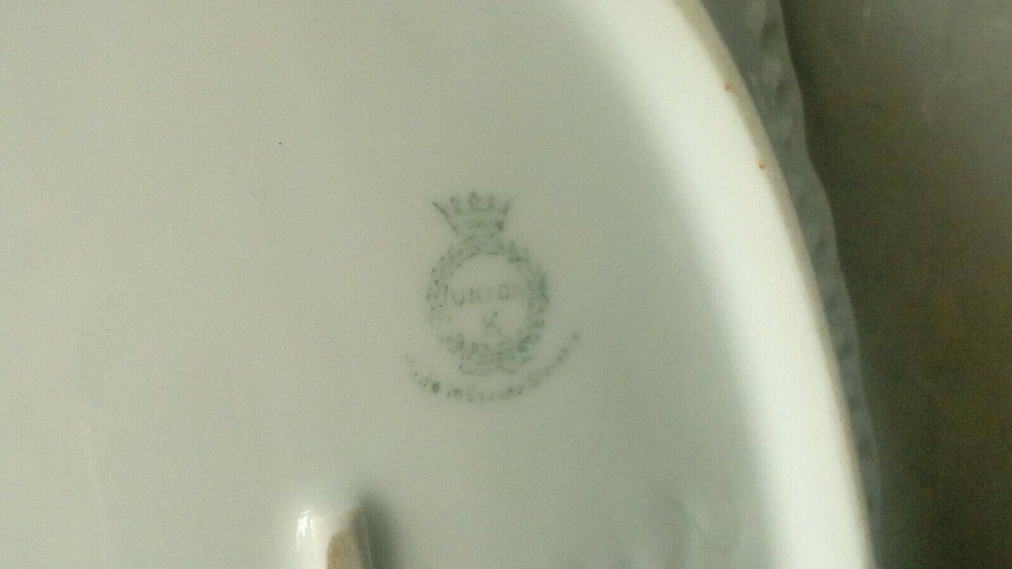 Pierced porcelain basket decorated with fruit still life.