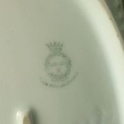 Pierced porcelain basket decorated with fruit still life.