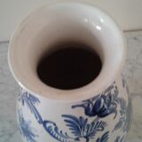 Blue vase adorned with blue and white