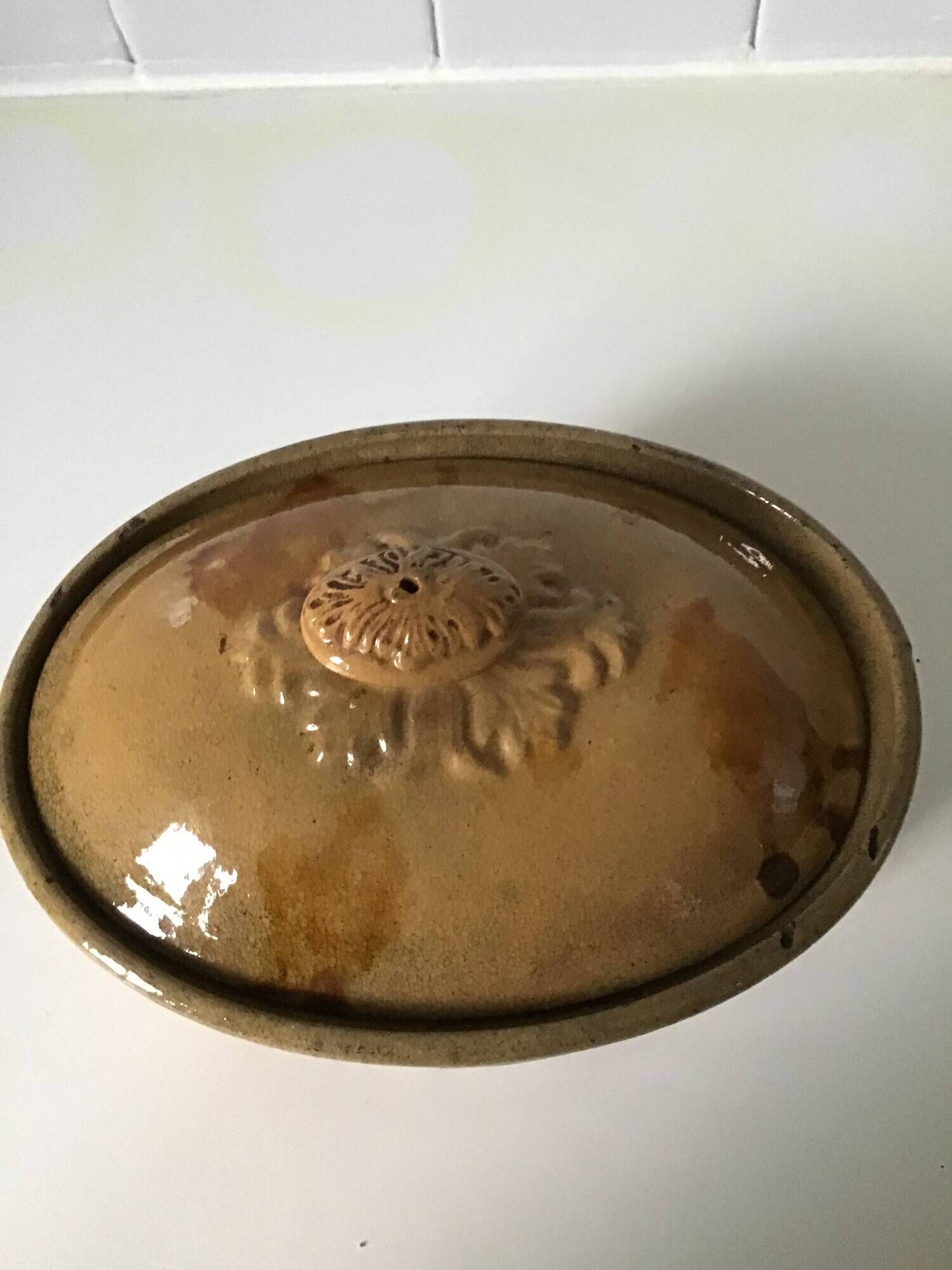 Old terrine of pastry or foie gras in beige glazed earthenware with brown drips. Very beautiful pa