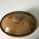 Old terrine of pastry or foie gras in beige glazed earthenware with brown drips. Very beautiful pa