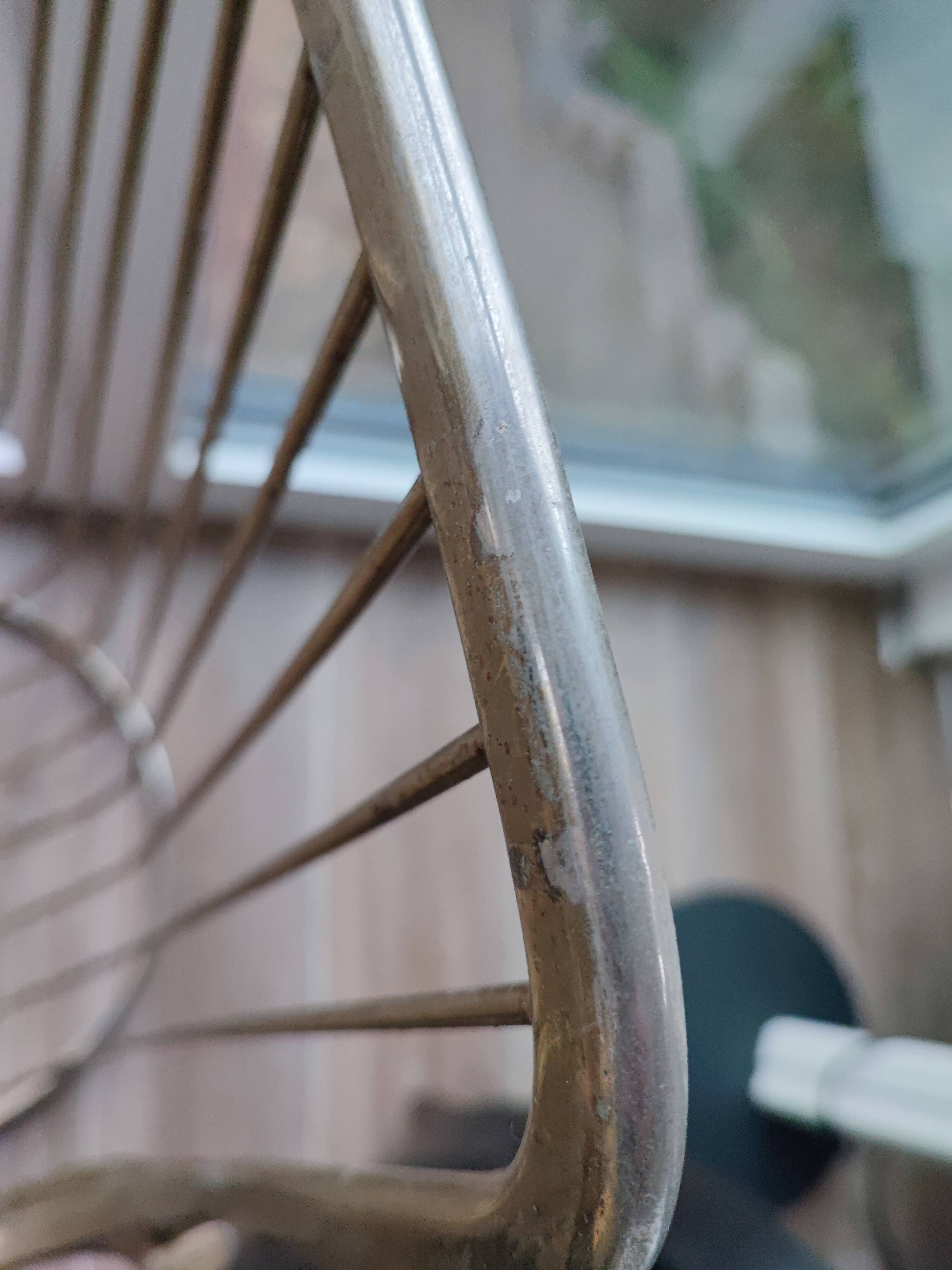 Tubular metal chair covered with gilding