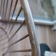 Tubular metal chair covered with gilding