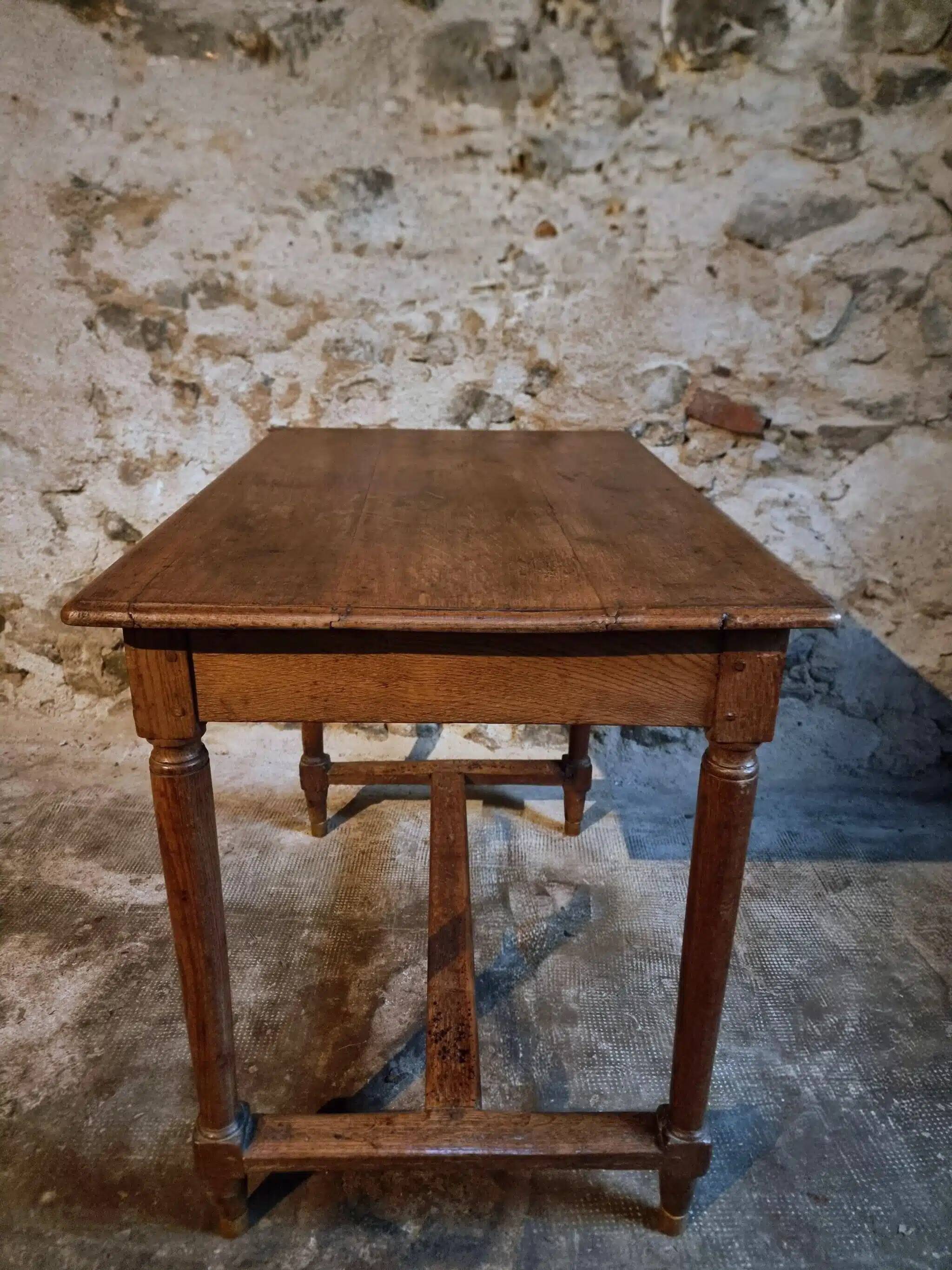 Antique French oak table, writing table from the early 19th century.