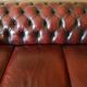 Three-seater burgundy burgundy leather chesterfield sofa