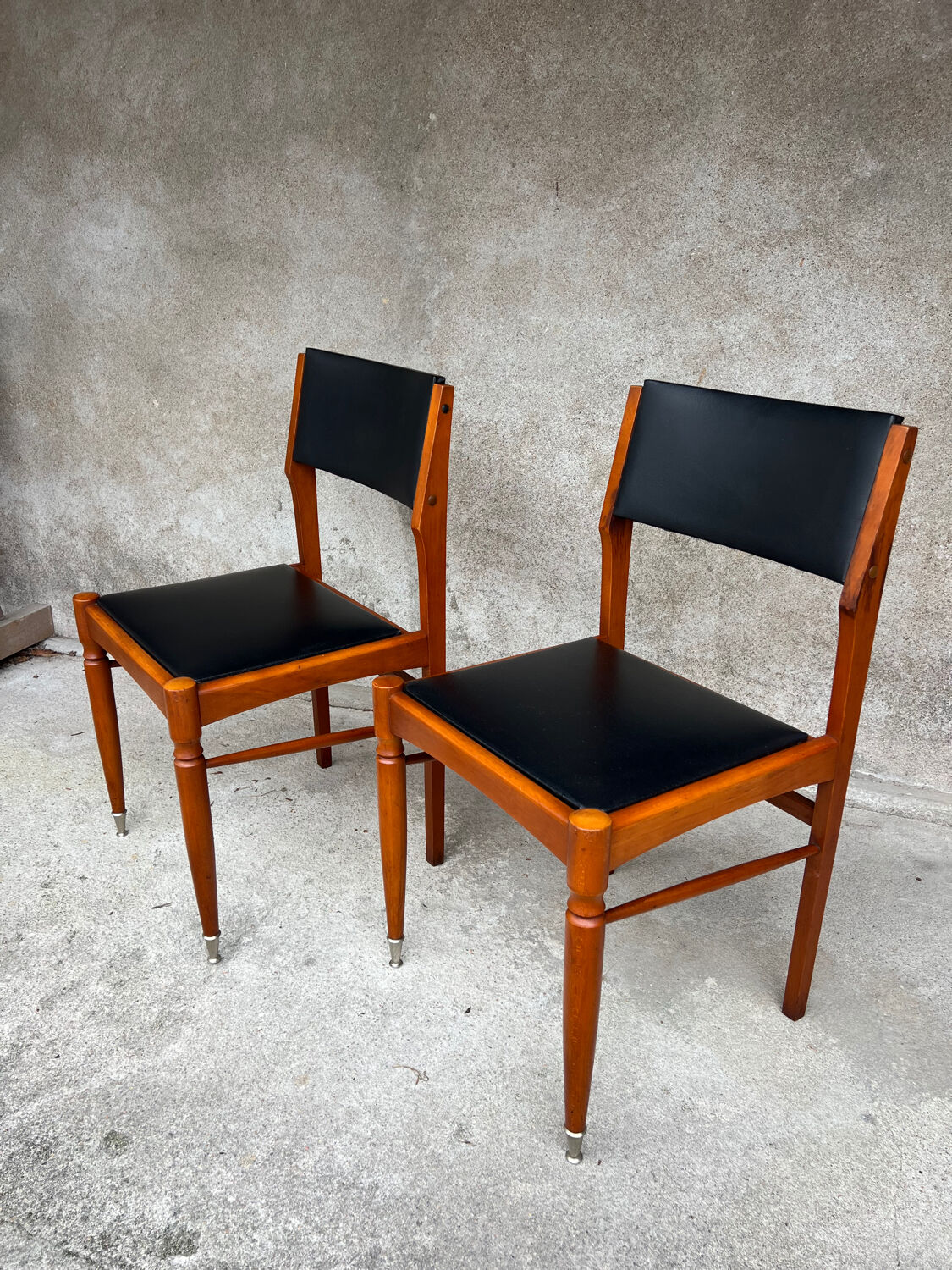 2 wooden and faux leather chairs in Scandinavian style