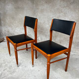 2 wooden and faux leather chairs in Scandinavian style