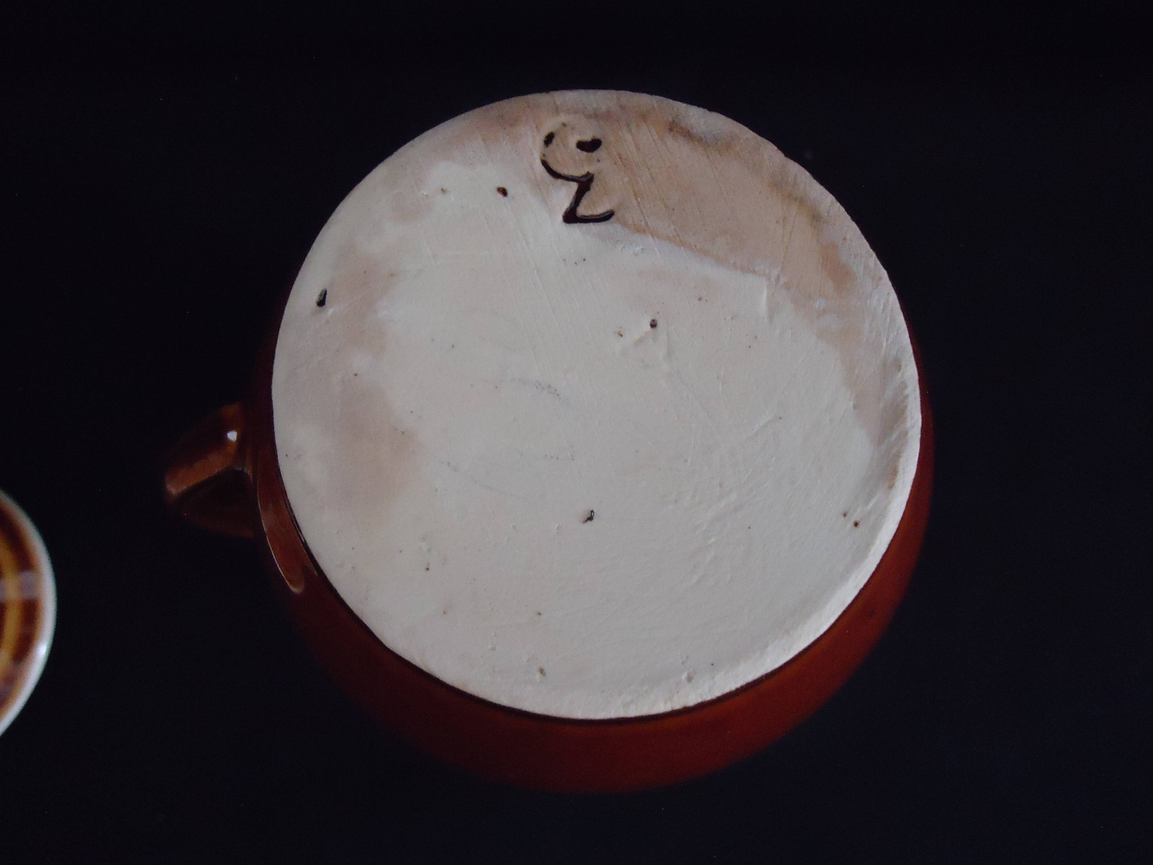 Old covered milk jug, side handle