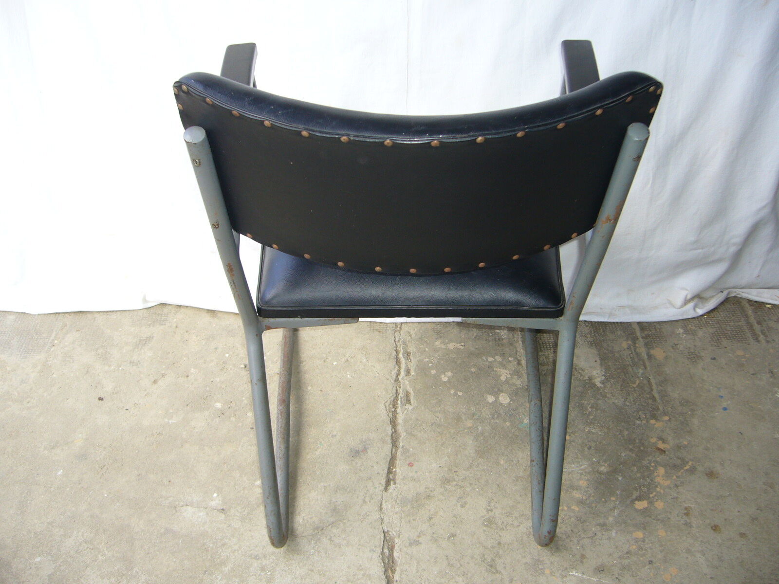 Old industrial chair in skai and metal