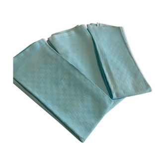 Trois serviettes turquoise