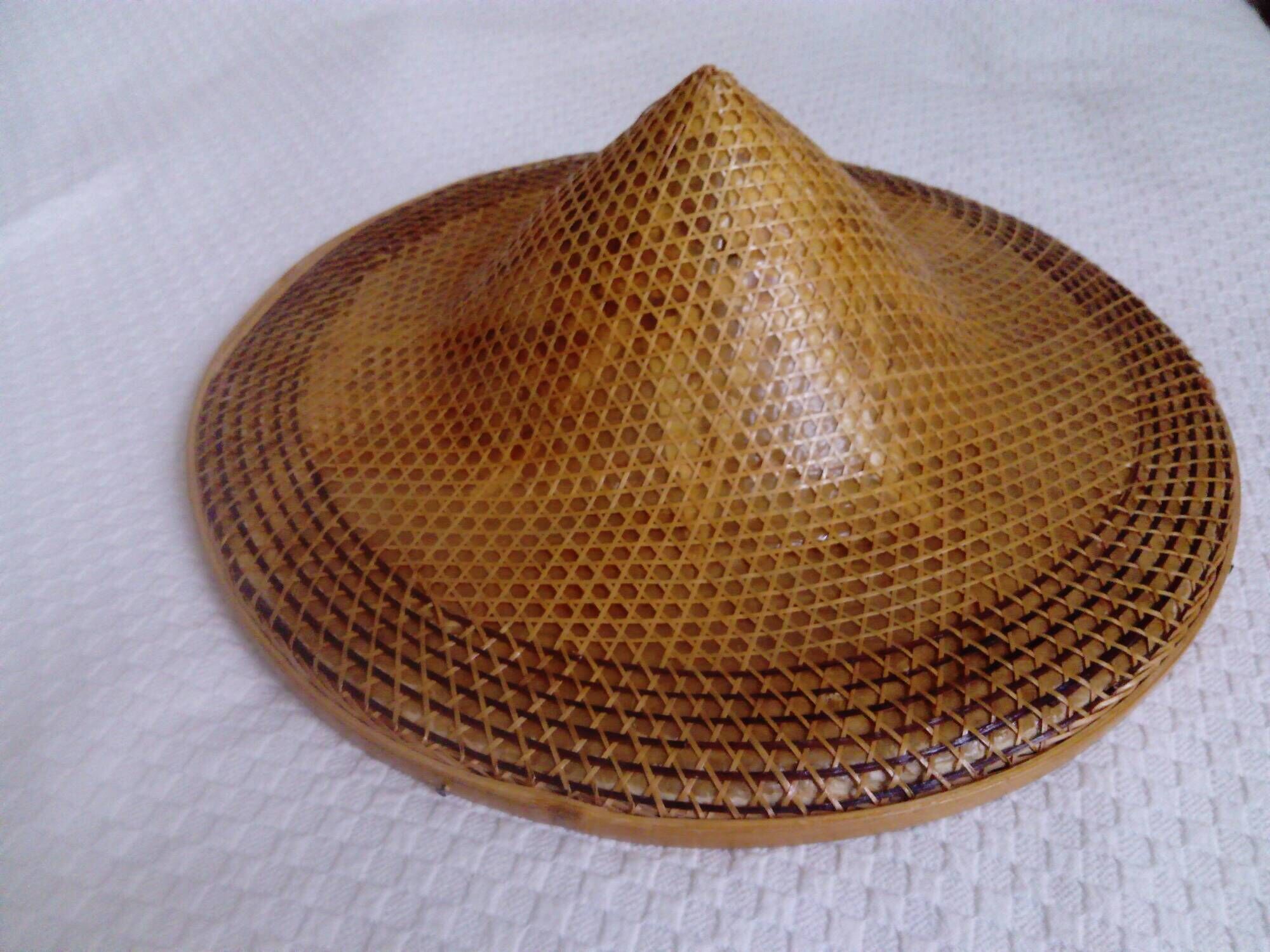 braided Asian hat. palm, bamboo, straw, wicker