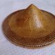 braided Asian hat. palm, bamboo, straw, wicker
