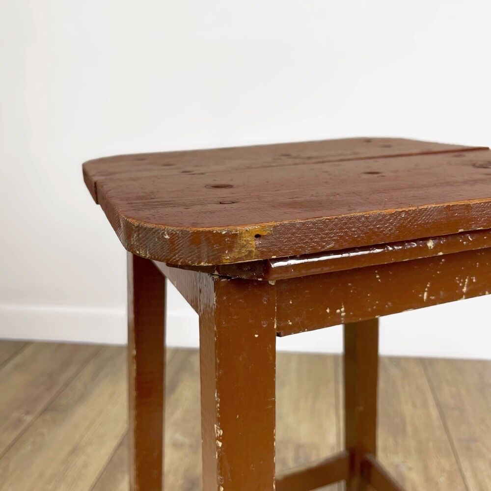 Old solid chocolate wooden stool
