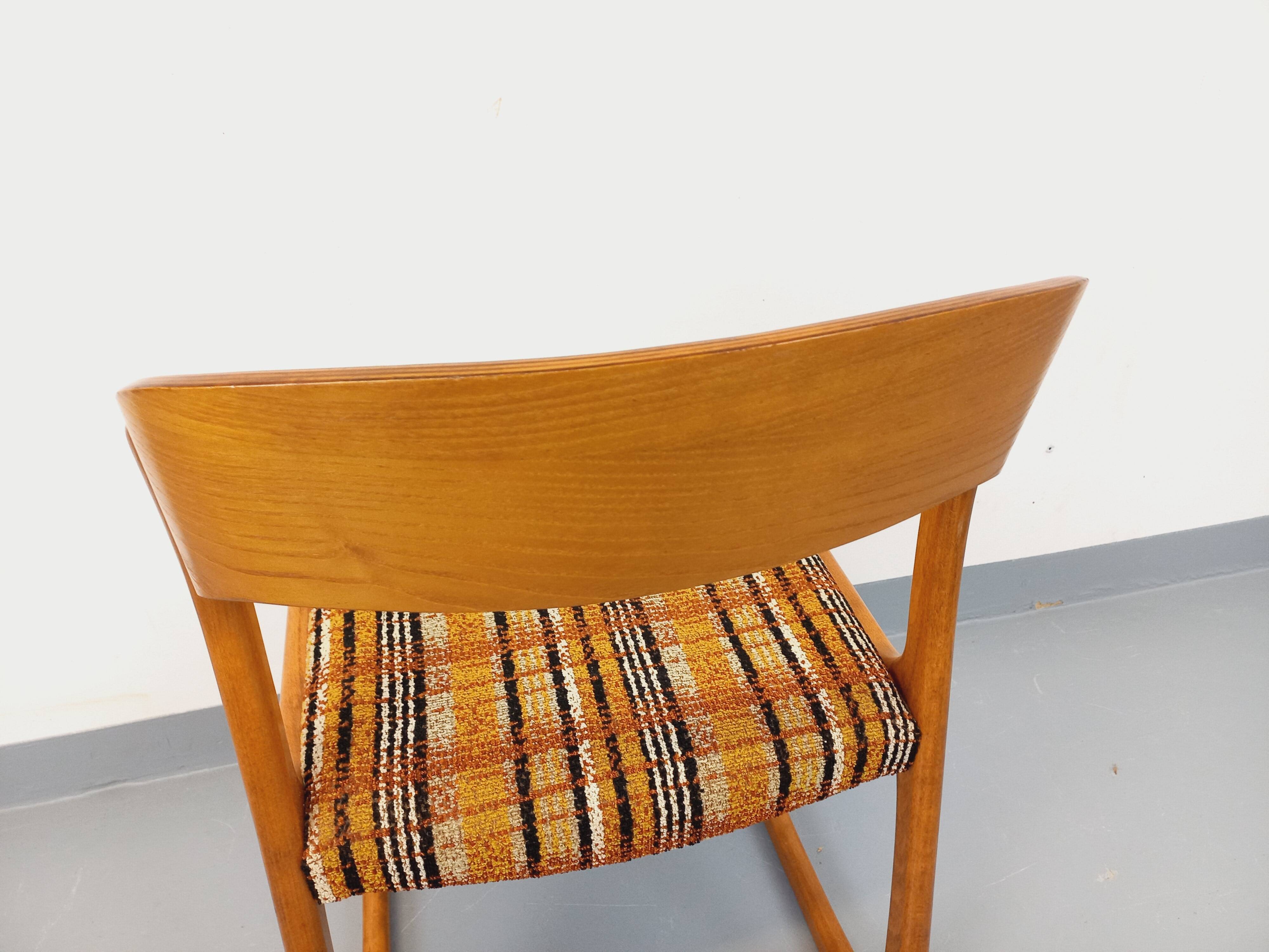 Vintage sled chair by Baumann in wood and wool fabric.