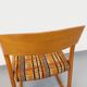 Vintage sled chair by Baumann in wood and wool fabric.