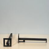 Pair of modernist andirons in steel and wrought iron