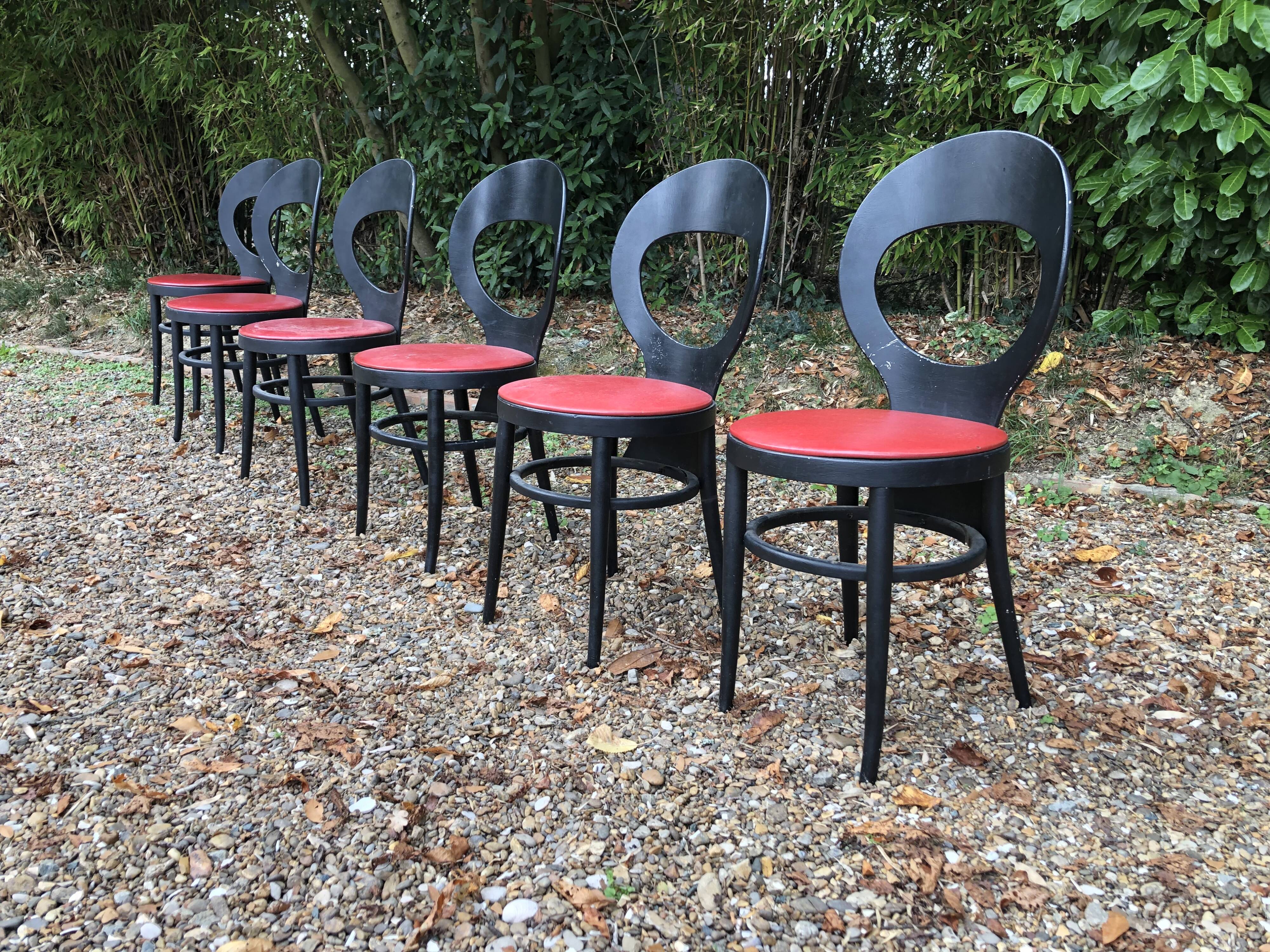 6 vintage Baumann seagull model chairs, black lacquered with red Skai seats.