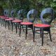6 vintage Baumann seagull model chairs, black lacquered with red Skai seats.