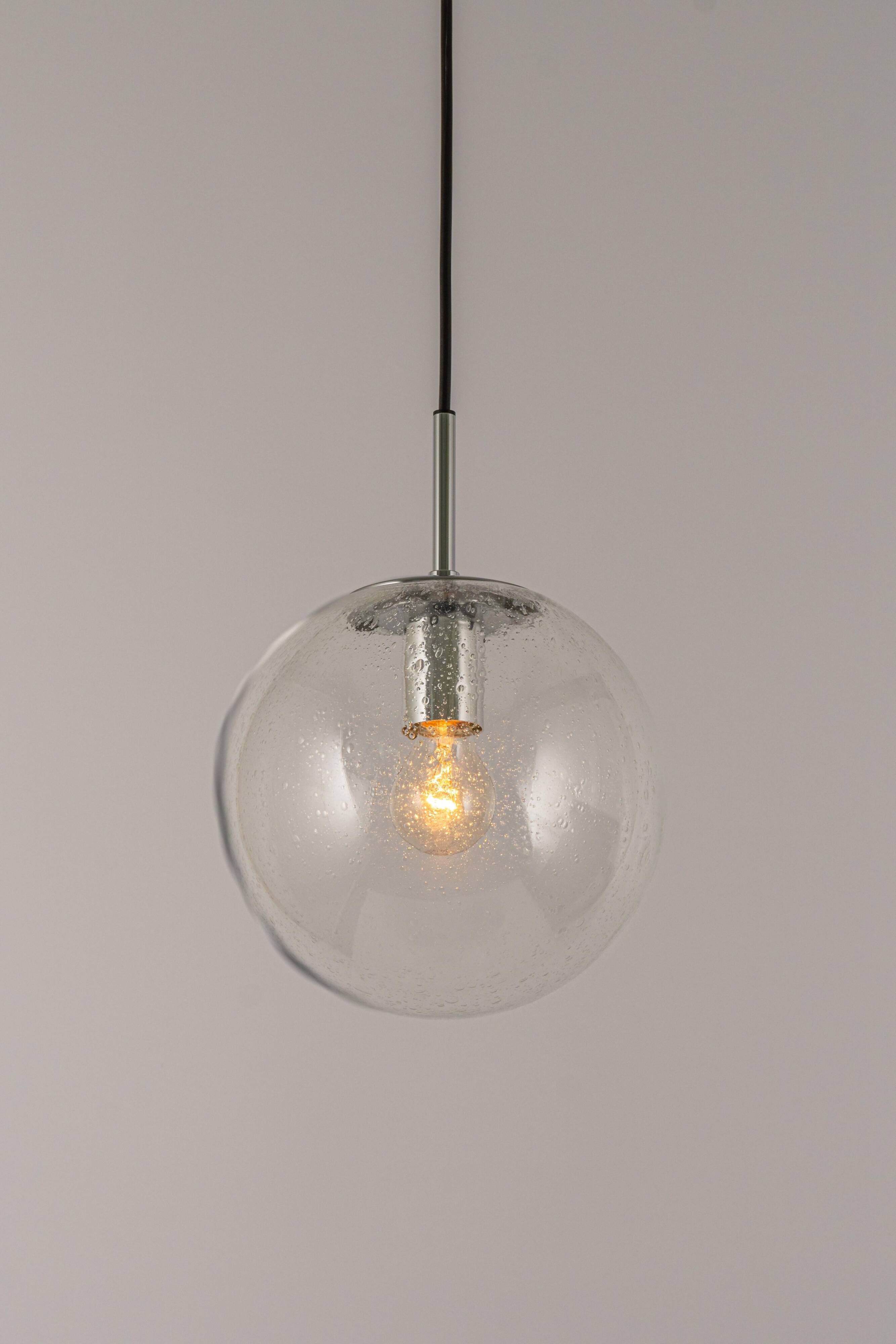 Small Limburg chrome pendant light with clear glass globe, Germany, 1970s.