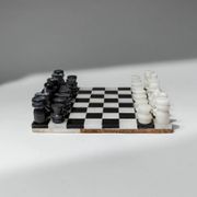Vintage black-and-white marble chessboard with matching marble pieces, Italian 1960s design, sculptural centerpiece