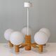 Space age chandelier in 5-arm wood with white frosted opaline glass spheres.