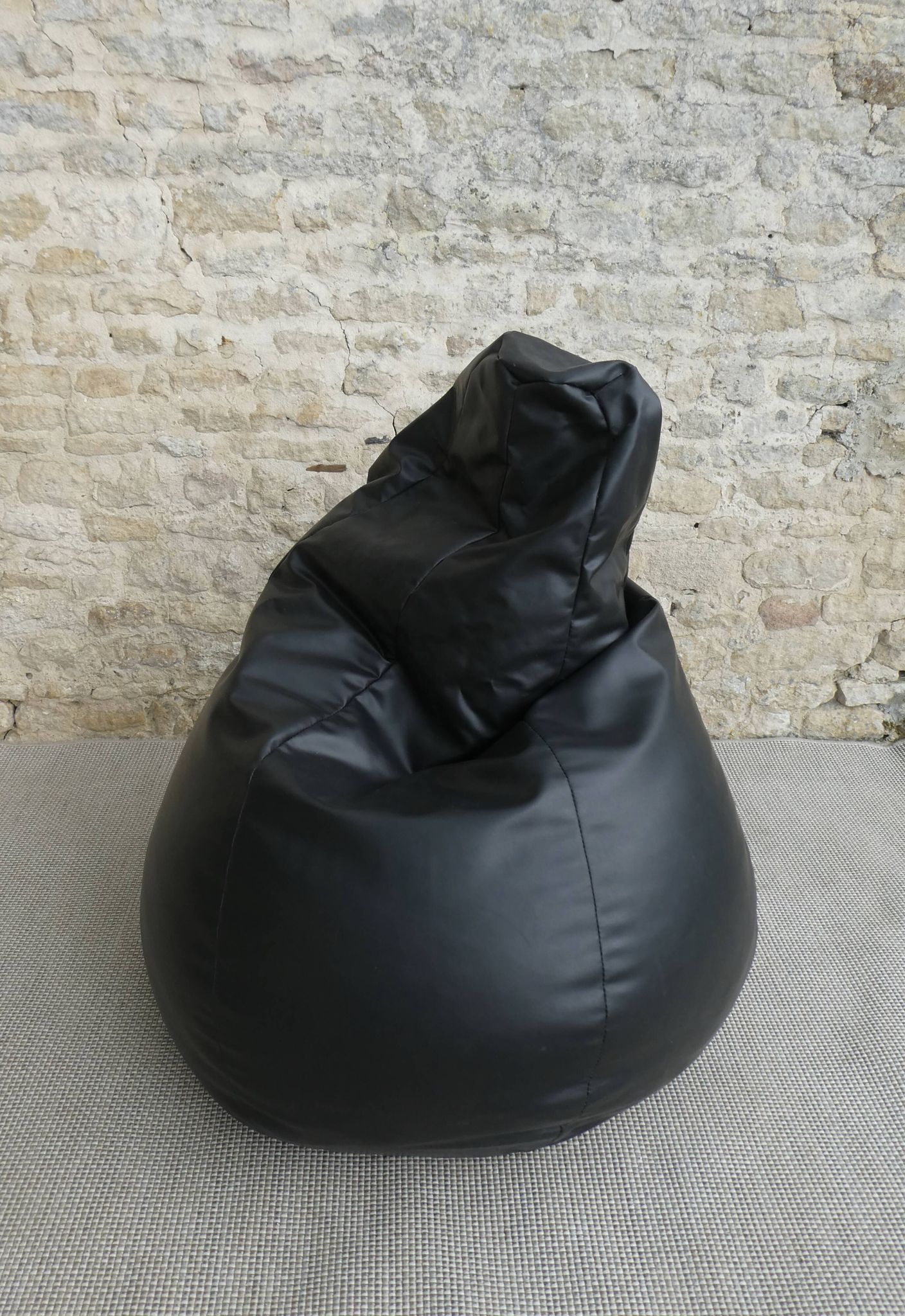Pear armchair in imitation black leather