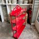 Wall shelf with 4 red lacquered wooden shelves.