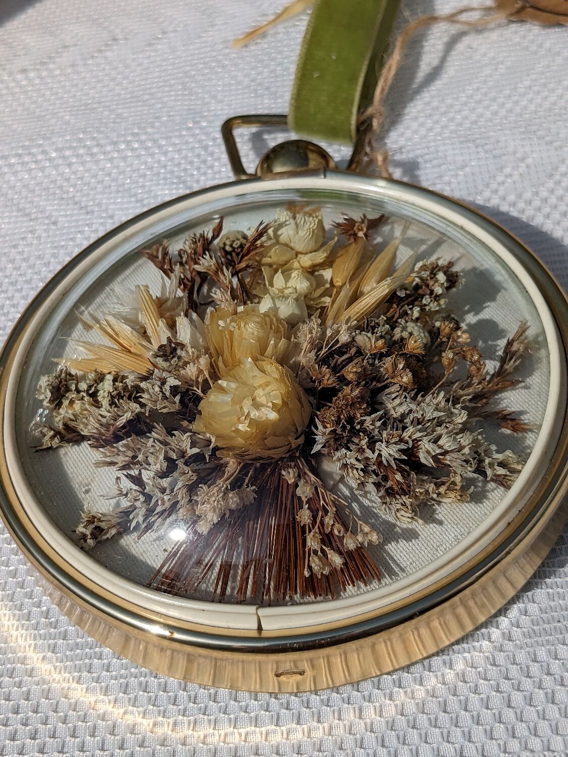Domed frame of dried flowers