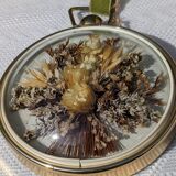 Domed frame of dried flowers