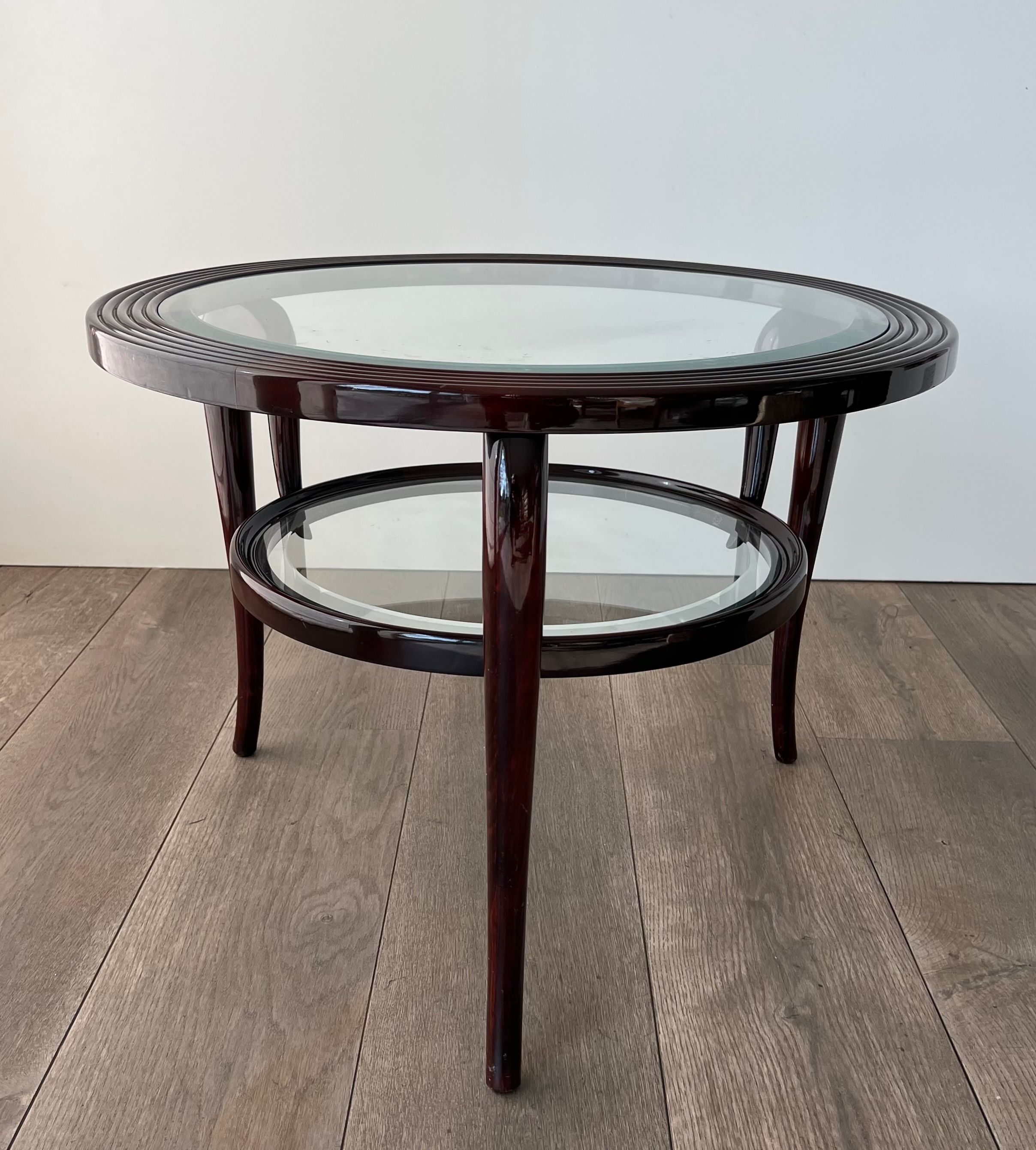 Round mid-century coffee table in walnut with a double top by Paolo Buffa.