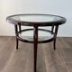 Round mid-century coffee table in walnut with a double top by Paolo Buffa.