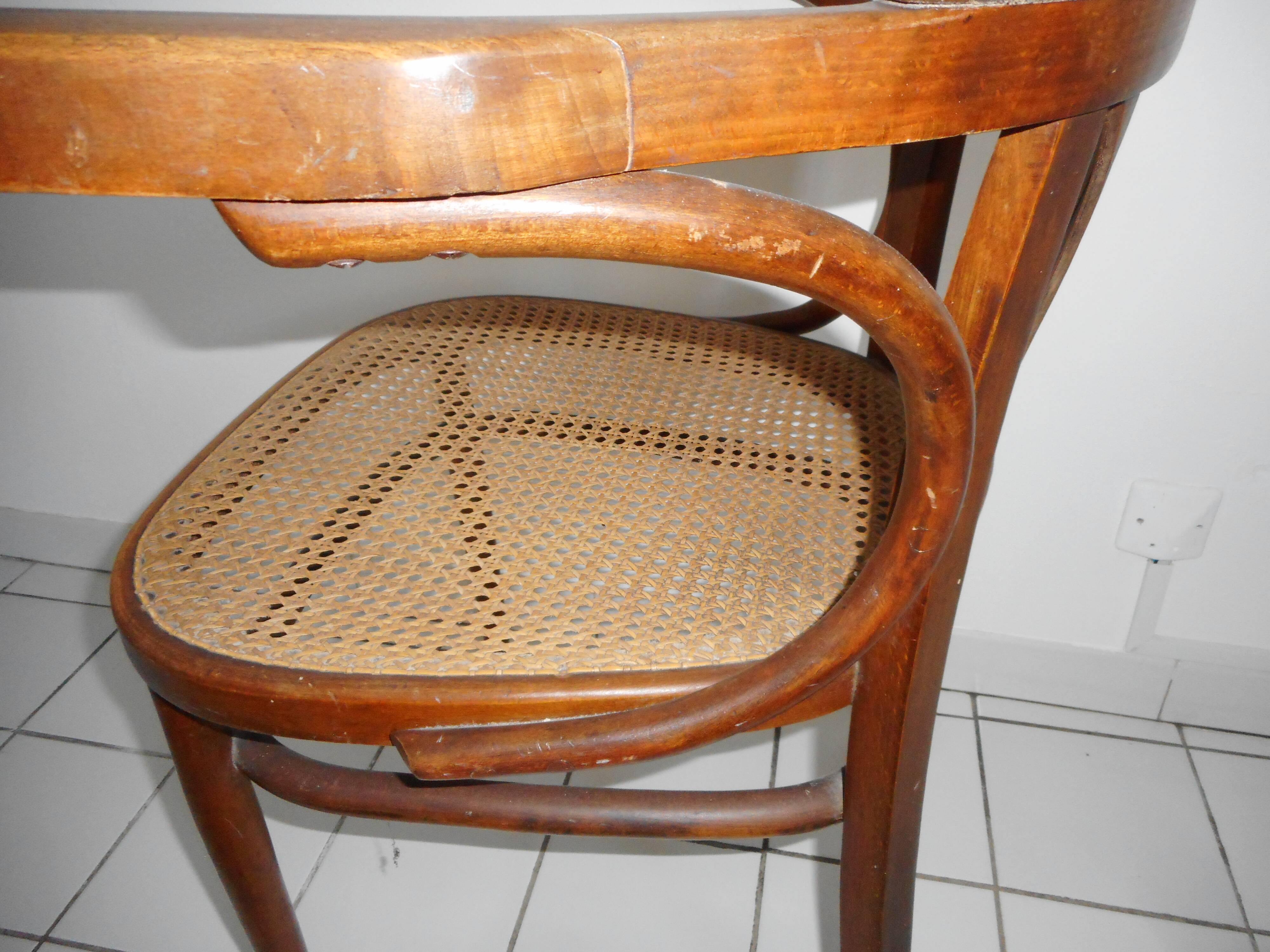 Wooden armchair with caned base