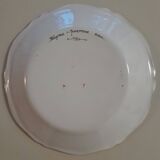 Earthenware plate with bird flute player decoration