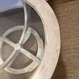 Oval patinated wood and beveled glass coffee table