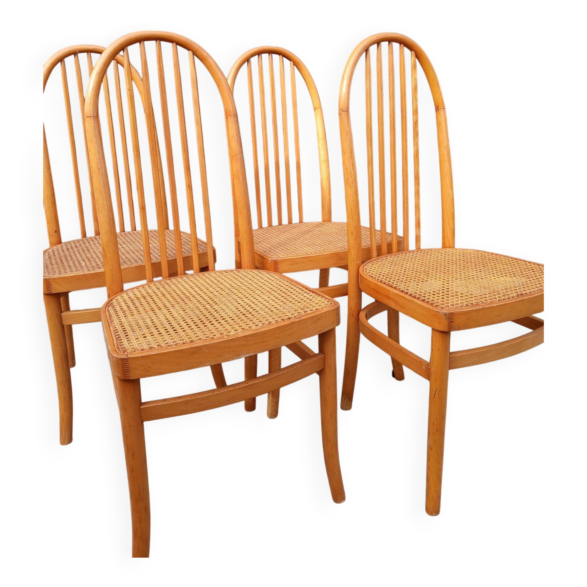 Set of 4 vintage Baumann chairs in honey wood and cane.
