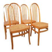 Set of 4 vintage Baumann chairs in honey wood and cane.