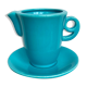Milk jug on plate