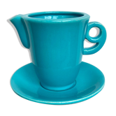 Milk jug on plate
