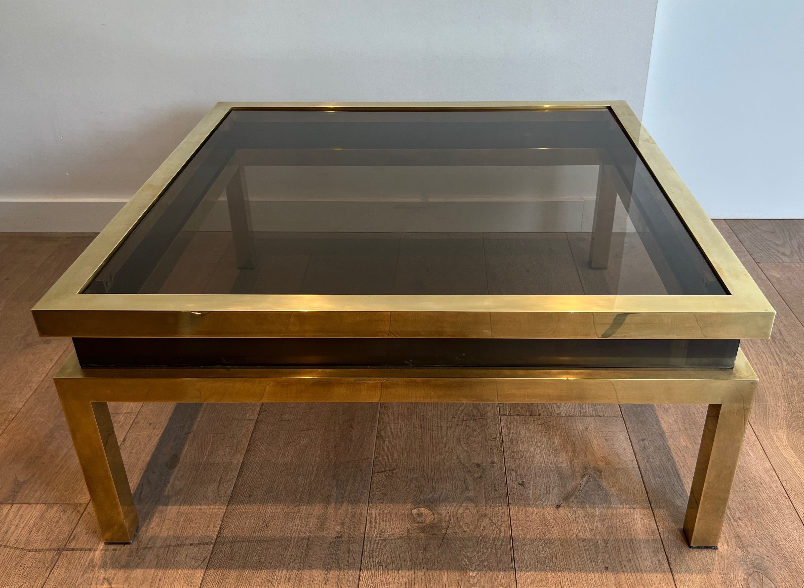 Coffee table in brass and black lacquer by Guy Lefèvre for Maison Jansen