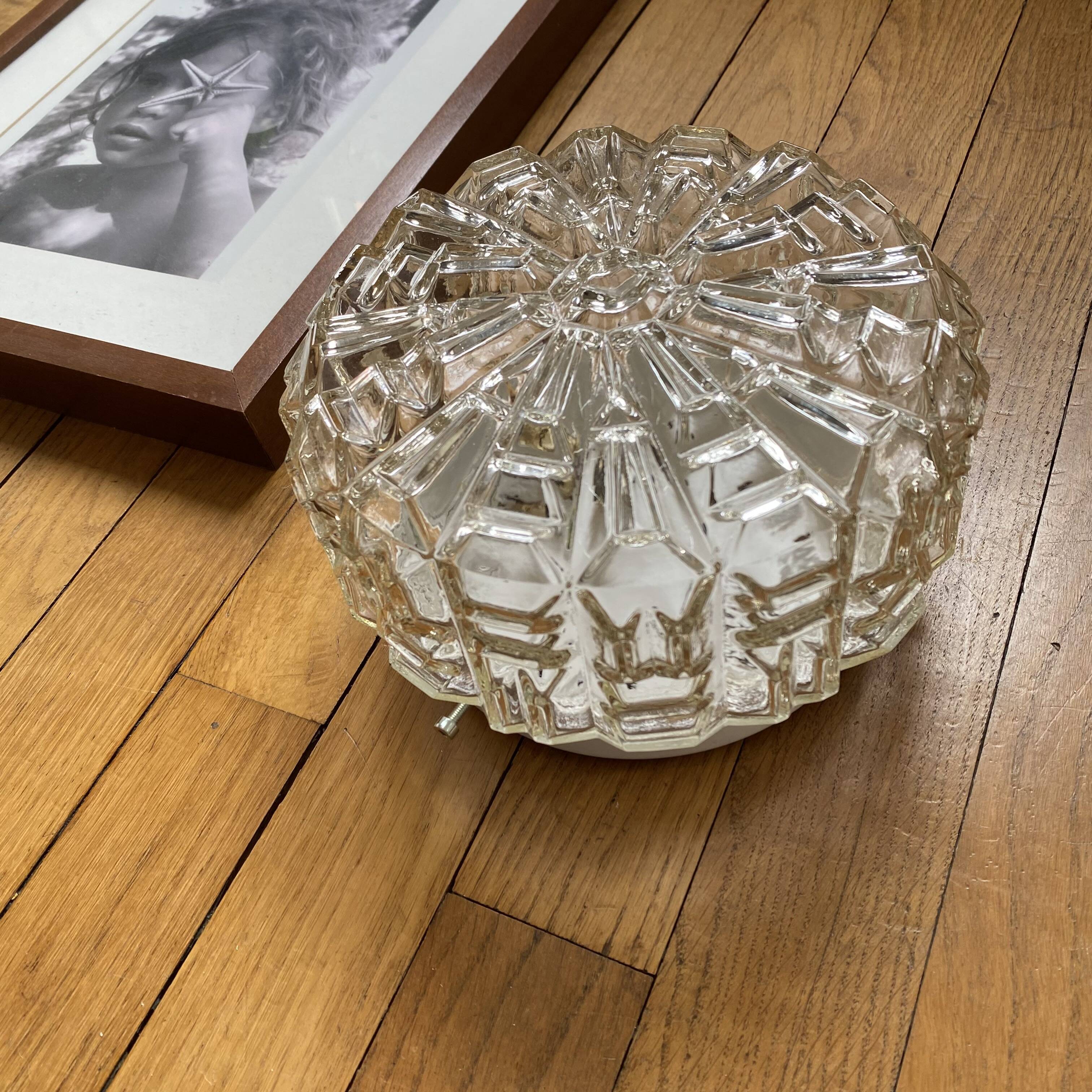 Wall lamp or ceiling light with minimalist porthole glass.