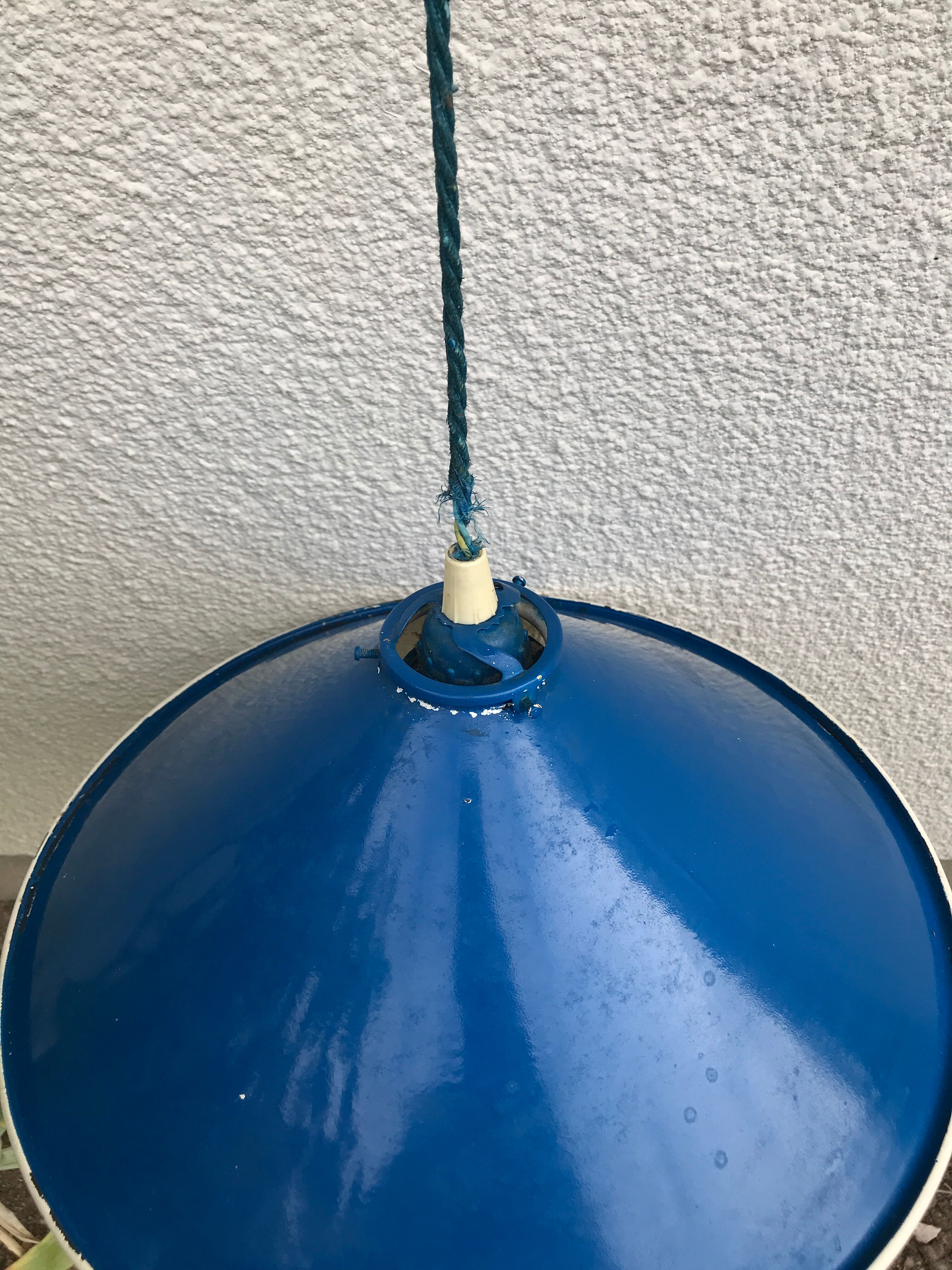 Blue and white painted metal hanging and its mount and drop