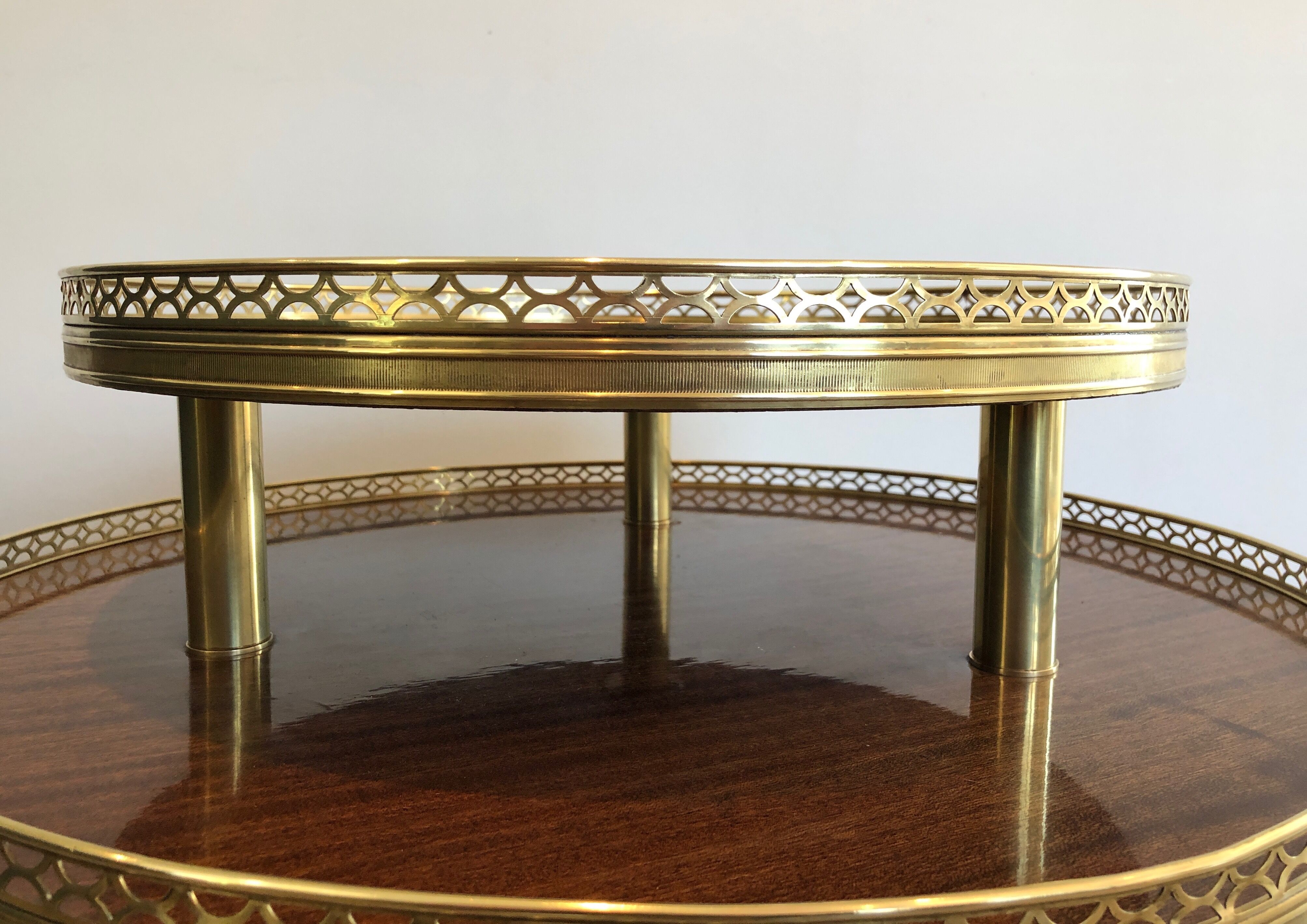 Neoclassical style tripod pedestal in mahogany, brass