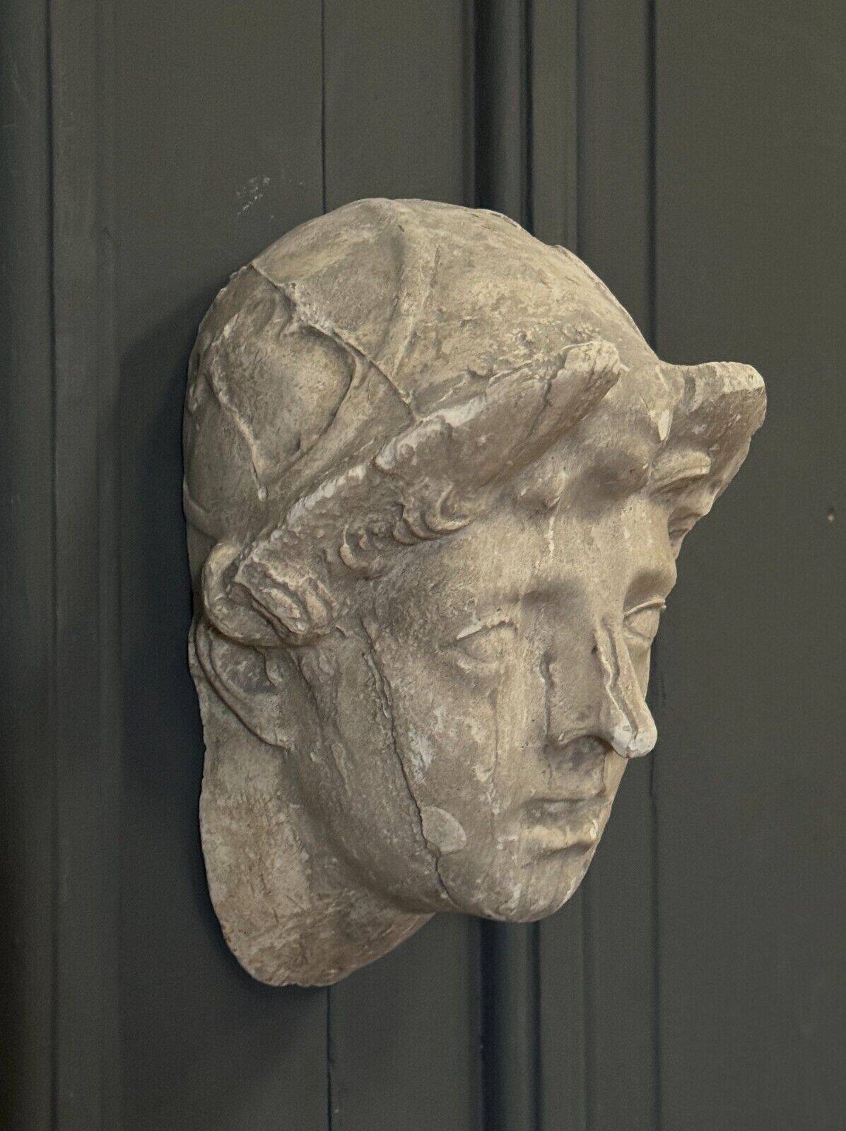 Antique plaster sculpture of a female face from the early 20th century
