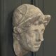 Antique plaster sculpture of a female face from the early 20th century