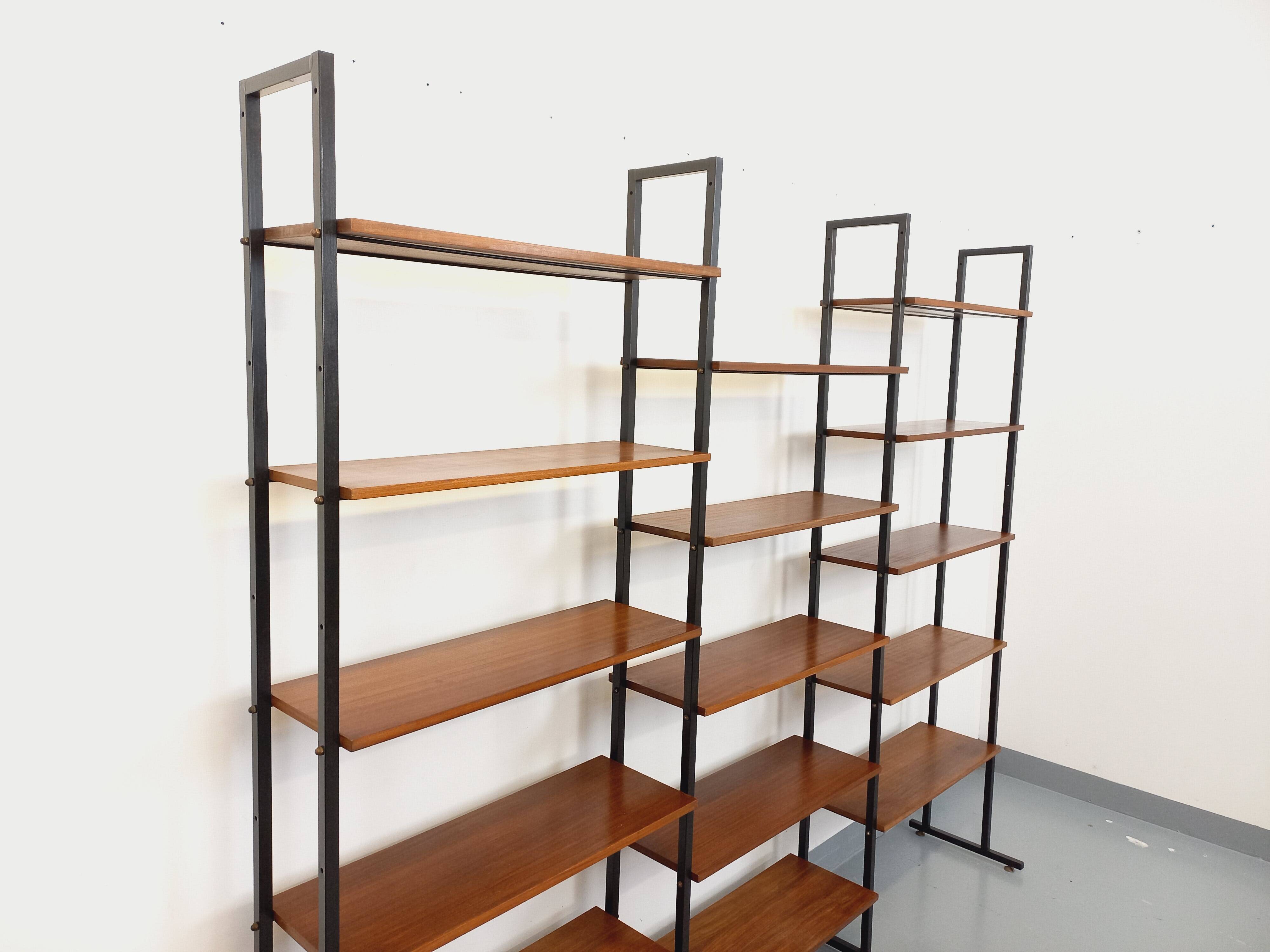 Vintage Italian triple modular bookshelf in teak and metal.