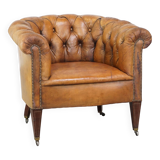 Fauteuil chesterfield sur roulettes en cuir de mouton